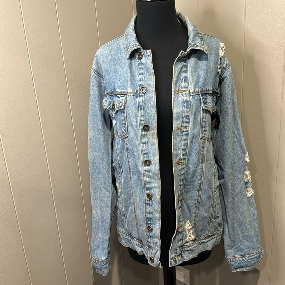 EMPYRE light blue distressed denim jean jacket. Small. 100% cotton.